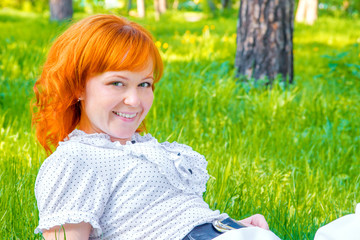Happy woman on green grass