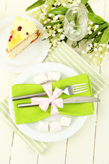 Table setting in white and green tones