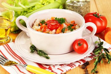 Delicious rice with vegetables and herbs in pot