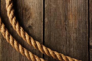 Fototapeta premium Rope over wooden background