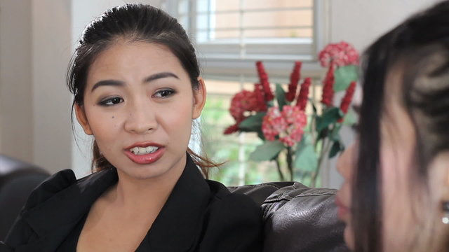 Two Asian Ladies Talking At Work