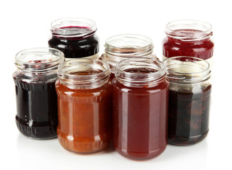 Tasty jam in banks isolated on white