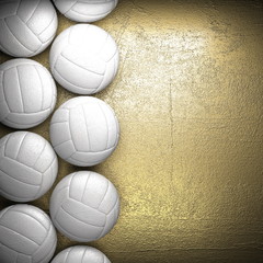 Ballon de volley-ball et fond de mur doré