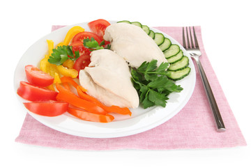 Boiled chicken breast on plate with vegetables isolated on