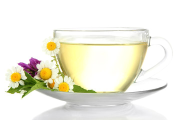 Cup of herbal tea with wild flowers and mint, isolated on white