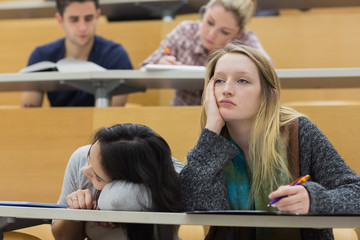 Demotivated students in a lecture hall - 53023590