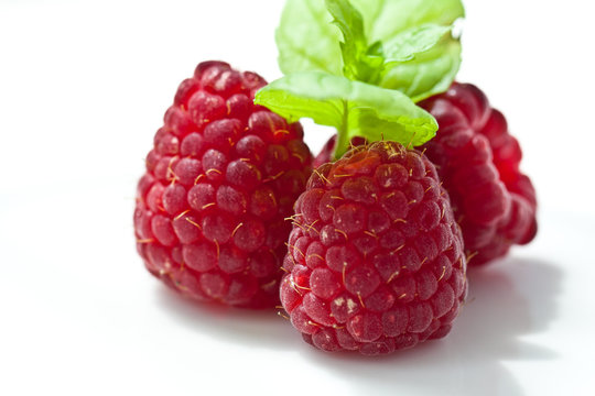 Raspberry fruit closeup isolated on white background 