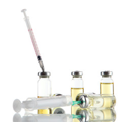 Fototapeta na wymiar Medical bottles and syringes isolated on white