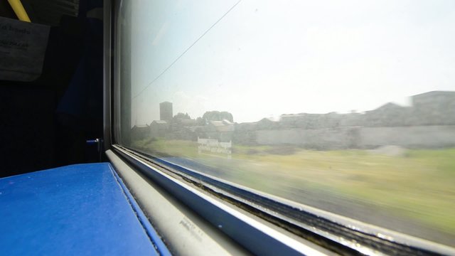 looking out the window of speeding train