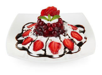 Tasty jelly dessert with fresh berries and ice-cream, isolated