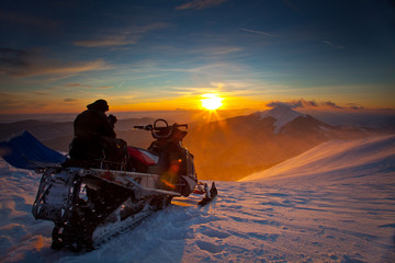 The snowmobile on a beautiful winter landscape - obrazy, fototapety, plakaty
