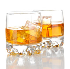 Brandy glasses with ice isolated on white