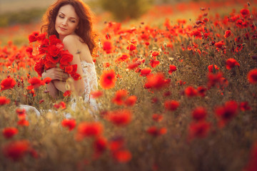 The bride  in a poppy field