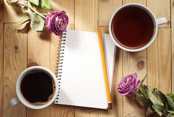 Cup of tea, coffee and notebook