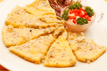 slices of polenta with sauce