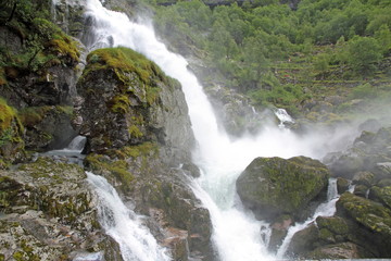 Waterfall springing Briksdal glacier, Jostedalsbreen , Norway.