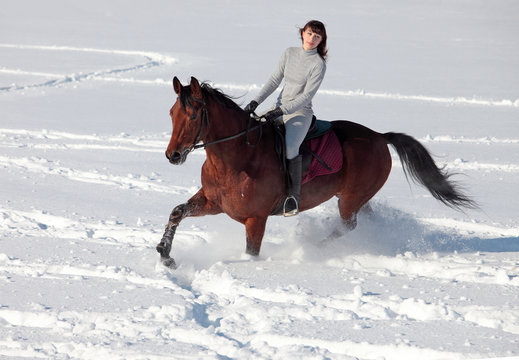 Women ride along in the fresh snow