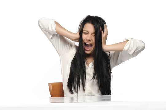 A frustrated and angry woman is screaming 