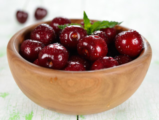 Fresh cherries in a wooden bowl