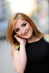 Obraz premium Cute girl posing on a city street