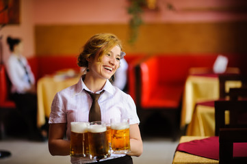 waiter with beer in the hands
