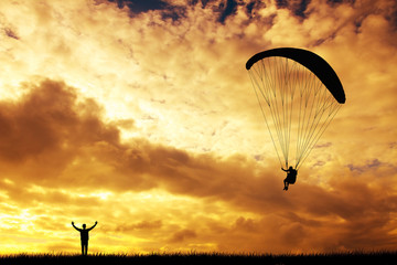 paraglider at sunset - obrazy, fototapety, plakaty