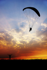 paraglider at sunset