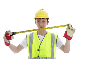 Apprentice holding builders tape measure