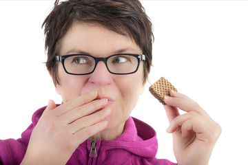 Woman eating biscuit