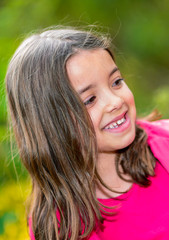 Natural portrait of a happy pretty little girl