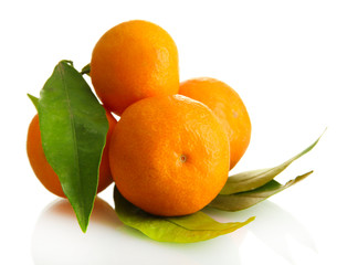 Ripe sweet tangerines with leaves, isolated on white