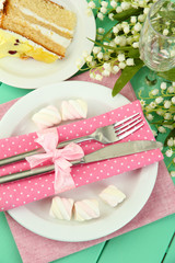 Table setting in white and pink tones