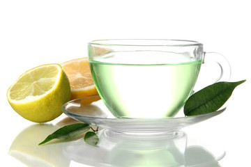 Transparent cup of green tea with lemon, isolated on white
