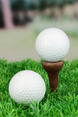 Golf balls on grass outdoor close up