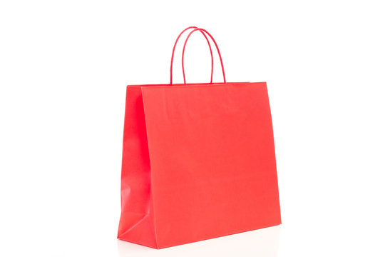 Single red shopping bag on white background