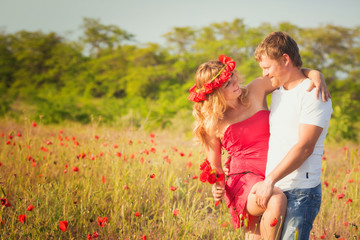 Couple on the poppy meadow