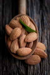 Almonds on a wooden spoon