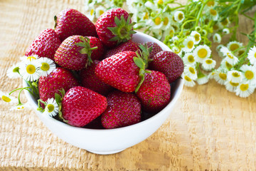 Fresh strawberry in the white bowl