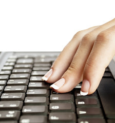 Female fingers typing on keyboard