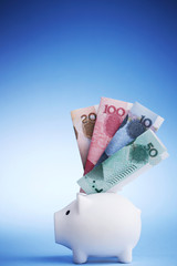 Piggy bank with Yuan bill