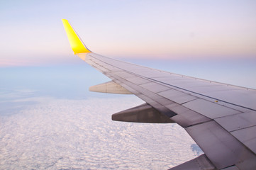 Obraz premium Clouds and sky as seen through window of an aircraft in night