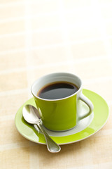 black coffee in green cup