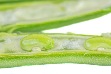 Green beans exposed pods close up view