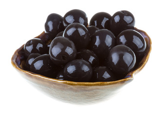 Olives black watered with olive oil in a bowl isolated on a whit