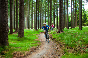 Two women riding bikes