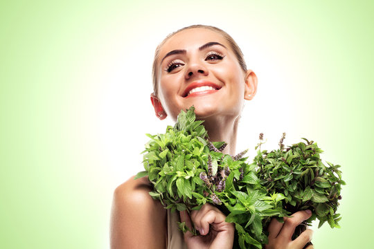 woman with a bundle of fresh mint. Concept vegetarian dieting