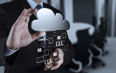 Businessman working with a Cloud Computing diagram on the new co