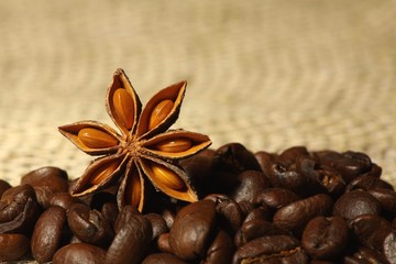 Coffee and Star Anise on sackcloth background with copyspace