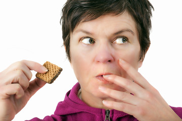 Woman eating biscuit