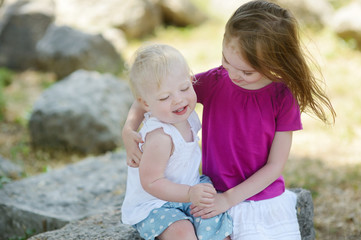 Fototapeta premium Portrait of two little sisters